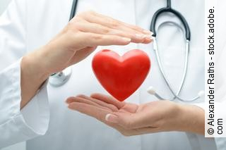 Doctor holding heart