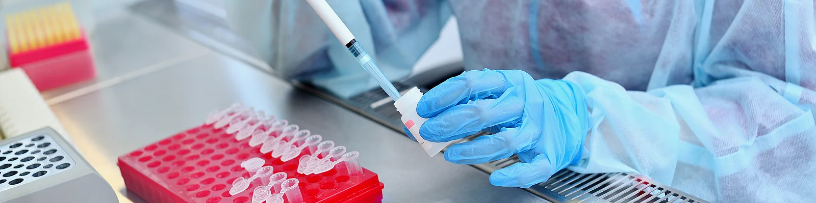 Dna test in the lab. a laboratory technician with a dispenser in Dna test in the lab. a laboratory technician with a dispenser in